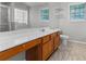 This primary bathroom has a large vanity that provides plenty of counter space and wooden cabinets at 6416 Chestnut Glen Dr, Norcross, GA 30071