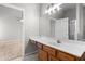 This primary bathroom features a large vanity with a sink plus a mirror that extends the length of the counter at 6416 Chestnut Glen Dr, Norcross, GA 30071