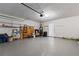 Spacious garage with an automatic garage door, built in shelving, and epoxy floor at 6416 Chestnut Glen Dr, Norcross, GA 30071