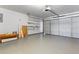 Spacious garage with an automatic garage door, built in shelving, and epoxy floor at 6416 Chestnut Glen Dr, Norcross, GA 30071