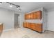 Kitchen featuring wooden cabinets and tiled floors at 6416 Chestnut Glen Dr, Norcross, GA 30071