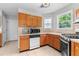 Well-equipped kitchen with wooden cabinets, stainless steel appliances, and tiled flooring at 6416 Chestnut Glen Dr, Norcross, GA 30071