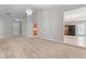 Open living room with easy access to kitchen and entry, offering a modern and interconnected living space at 6416 Chestnut Glen Dr, Norcross, GA 30071