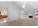 Bright living room featuring a fireplace and seamless flow into the kitchen, perfect for modern living at 6416 Chestnut Glen Dr, Norcross, GA 30071