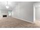Spacious living room with cozy fireplace and large windows, creating an inviting and comfortable atmosphere at 6416 Chestnut Glen Dr, Norcross, GA 30071