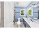 Bathroom boasts a sleek vanity, stylish lighting, and modern fixtures at 664 Somerset Dr, Lawrenceville, GA 30046