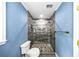 Bathroom featuring a modern shower with glass doors and a pebble floor at 664 Somerset Dr, Lawrenceville, GA 30046