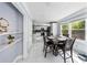 Eat-in dining room boasts natural light and views of the modern kitchen with tile floors at 664 Somerset Dr, Lawrenceville, GA 30046