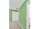 View of hallway with green walls, white trim, and a visible closet at 664 Somerset Dr, Lawrenceville, GA 30046
