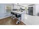 Modern kitchen with sleek appliances, a center island, and stylish black bar stools at 664 Somerset Dr, Lawrenceville, GA 30046