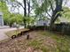 Fenced backyard with mature trees provides a private outdoor space for recreation at 712 Garibaldi Sw St, Atlanta, GA 30310