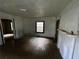 Spacious living room featuring hardwood floors and two windows that fill the space with natural light at 712 Garibaldi Sw St, Atlanta, GA 30310