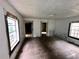 Spacious living room featuring hardwood floors and two windows that fill the space with natural light at 712 Garibaldi Sw St, Atlanta, GA 30310