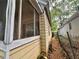 Exterior view of home with a screened in porch featuring painted, wood siding at 712 Garibaldi Sw St, Atlanta, GA 30310