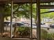 View from inside a screened-in porch, offering an outdoor living space with views of the neighborhood at 712 Garibaldi Sw St, Atlanta, GA 30310