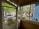 View from inside a screened-in porch, offering an outdoor living space with views of the neighborhood at 712 Garibaldi Sw St, Atlanta, GA 30310