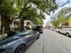 Street view with parked cars along the tree lined street at 712 Garibaldi Sw St, Atlanta, GA 30310