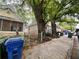 A street view showcasing cozy homes with colorful facades, green foliage, and sidewalks in a residential area at 712 Garibaldi Sw St, Atlanta, GA 30310