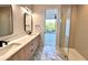 Modern bathroom with double sinks, marble countertops, and a glass-enclosed shower at 105 Georgia Se Ave # 6, Atlanta, GA 30312