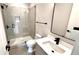 This modern bathroom features a walk in shower, tile surround, and floating vanity at 105 Georgia Se Ave # 6, Atlanta, GA 30312