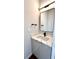 Modern half-bathroom with marble countertop and a sleek black faucet and mirror at 105 Georgia Se Ave # 6, Atlanta, GA 30312