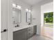 Modern bathroom features dual vanities, sleek fixtures, and a bright interior, offering a spa-like experience and contemporary elegance at 105 Georgia Se Ave # 6, Atlanta, GA 30312