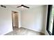 Bright bedroom featuring modern ceiling fan, stained concrete floors, and a built in closet at 105 Georgia Se Ave # 6, Atlanta, GA 30312