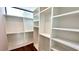 Walk-in closet with built-in shelves and hardwood floors at 105 Georgia Se Ave # 6, Atlanta, GA 30312