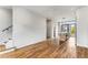 Open-concept living area with hardwood floors, modern kitchen, and staircase, perfect for entertaining and everyday living at 105 Georgia Se Ave # 6, Atlanta, GA 30312