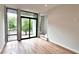 The living room has hardwood floors, large windows and a sliding glass door to the outside deck at 105 Georgia Se Ave # 6, Atlanta, GA 30312