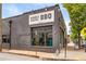Charming Wood's Chapel BBQ restaurant features a painted brick facade, ample windows and inviting storefront signage at 105 Georgia Se Ave # 6, Atlanta, GA 30312