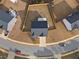 Aerial view of a home with a fenced backyard, surrounded by well-manicured landscaping and neighborhood streets at 165 Twin Lakes Dr, Covington, GA 30016