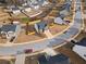 Aerial view of a neighborhood with well-maintained homes and landscaping at 165 Twin Lakes Dr, Covington, GA 30016