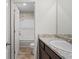 Bathroom featuring a granite countertop, modern fixtures, and a tub with a shower at 165 Twin Lakes Dr, Covington, GA 30016