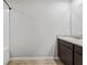 Light and airy bathroom with granite counters and a bathtub with shower head at 165 Twin Lakes Dr, Covington, GA 30016