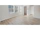 Well-lit bedroom featuring a walk-in closet, doorway and multiple windows at 165 Twin Lakes Dr, Covington, GA 30016