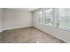 Bright and spacious bedroom featuring three windows and beautiful laminate flooring at 165 Twin Lakes Dr, Covington, GA 30016