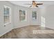 Cozy bedroom with plenty of natural light from multiple windows and ceiling fan at 165 Twin Lakes Dr, Covington, GA 30016