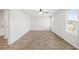 A bedroom with light walls, ceiling fan, and wood-look flooring at 165 Twin Lakes Dr, Covington, GA 30016