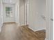 Hallway with wood floors and white walls and trim at 165 Twin Lakes Dr, Covington, GA 30016