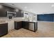 An eat in kitchen with granite countertops, dark wood cabinets, and stainless appliances at 165 Twin Lakes Dr, Covington, GA 30016