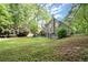 Green backyard with lush trees at 4635 Rutledge Dr, Snellville, GA 30039