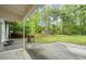 A spacious backyard featuring a shed, a fire pit, and a garden box from the home's porch at 4635 Rutledge Dr, Snellville, GA 30039