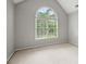 Bright bedroom featuring a large arched window that provides natural light at 4635 Rutledge Dr, Snellville, GA 30039