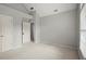 Neutral bedroom with carpet, two doors, and large window at 4635 Rutledge Dr, Snellville, GA 30039