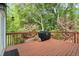 Wooden deck surrounded by lush greenery, offering a peaceful outdoor space at 4635 Rutledge Dr, Snellville, GA 30039