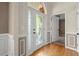 Elegant foyer showcasing a decorative glass front door, hardwood floors, and neutral wall colors at 4635 Rutledge Dr, Snellville, GA 30039
