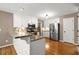 Kitchen with granite counters, stainless appliances, white cabinetry and hardwood flooring at 4635 Rutledge Dr, Snellville, GA 30039