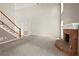 Large living room with high ceilings, a brick fireplace, and new carpet at 4635 Rutledge Dr, Snellville, GA 30039