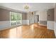 Spacious living room with hardwood floors, natural light, and neutral paint colors at 4635 Rutledge Dr, Snellville, GA 30039